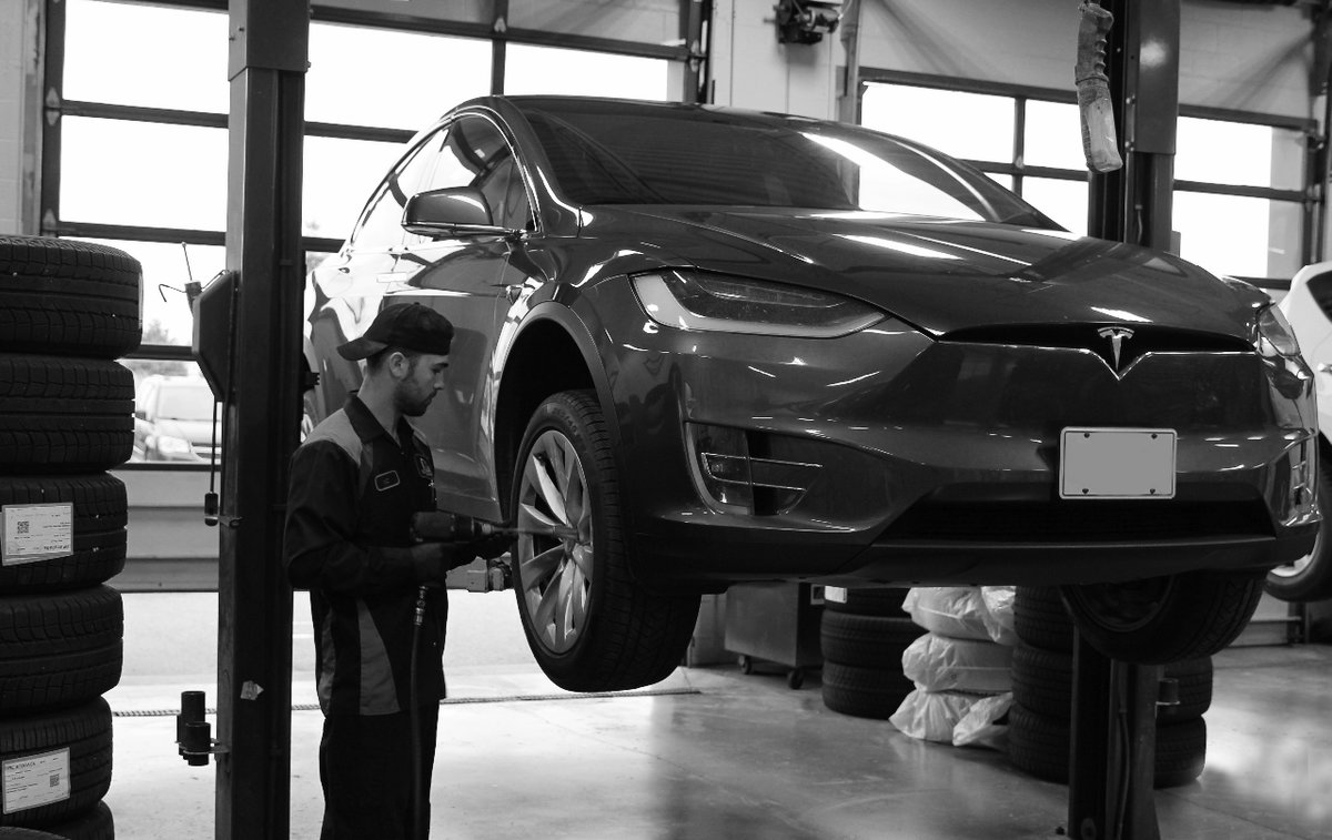 Mechanic working on a Tesla